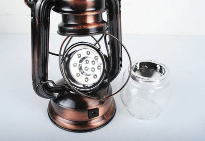 Close-up of internal LED light source and clear glass globe of a retro lantern.
