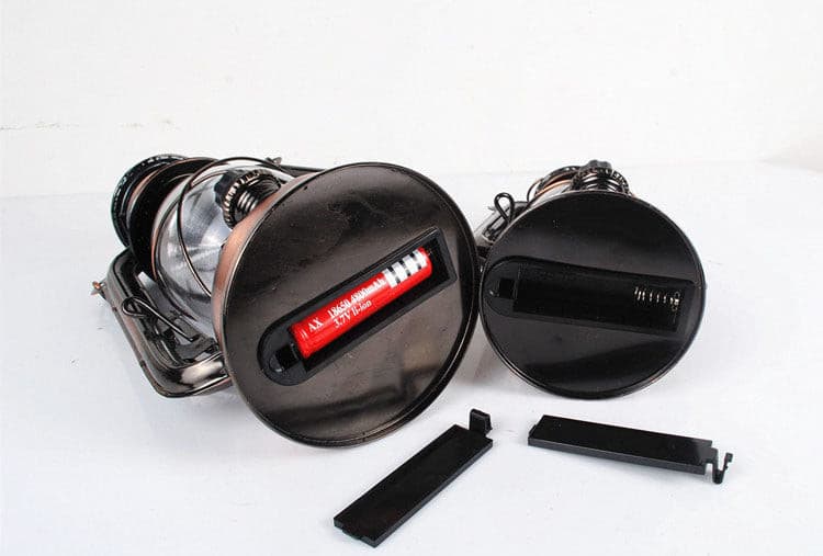 Bottom view of a rechargeable camping lantern showing the battery compartment.