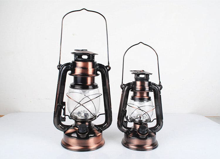 Two different sizes of antique bronze LED lanterns for decorative or outdoor use.