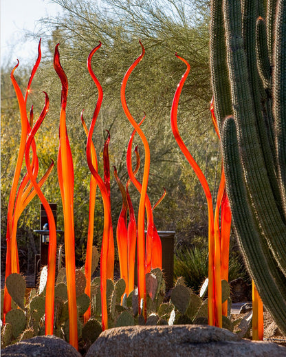 Garden blown glass installation set in orange color