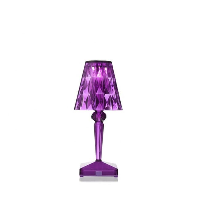 Vibrant purple acrylic crystal table lamp for creative room lighting effects.