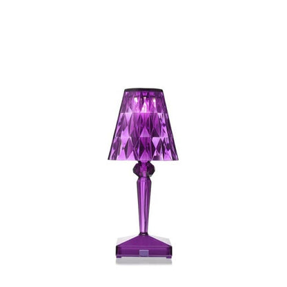 Vibrant purple acrylic crystal table lamp for creative room lighting effects.