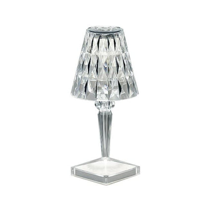 Contemporary clear crystal-style acrylic table lamp for elegant bedroom decor.