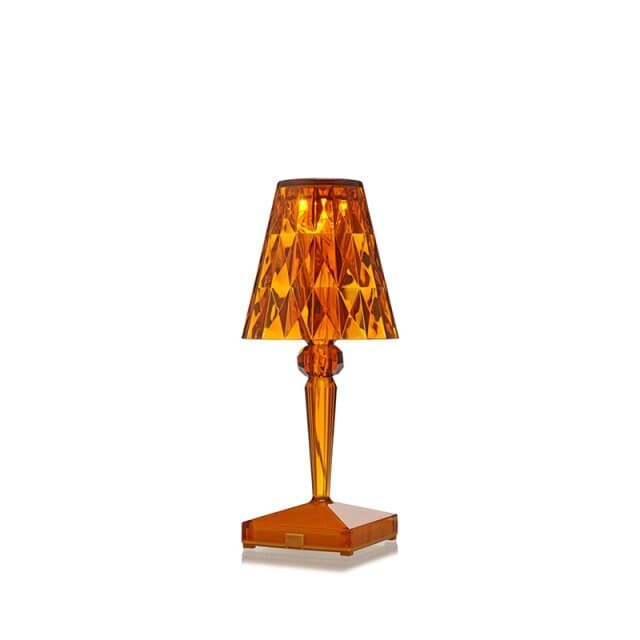 Warm amber acrylic crystal night light with faceted shade for bedside tables.