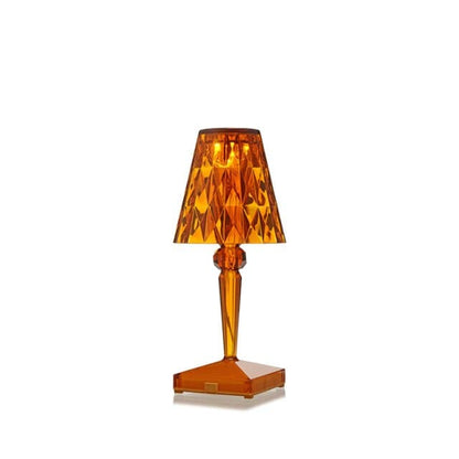 Warm amber acrylic crystal night light with faceted shade for bedside tables.